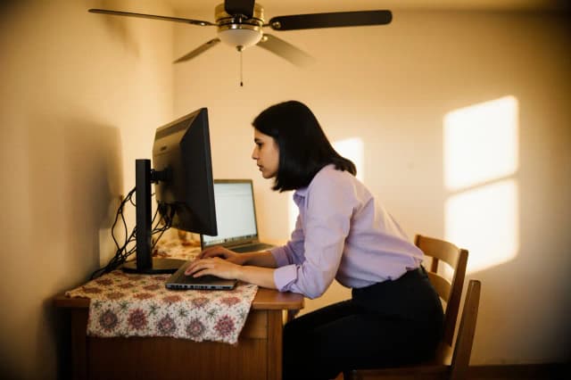 Worker with poor workstation posture